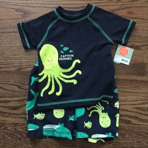 Carter’s swim shorts and rash guard
